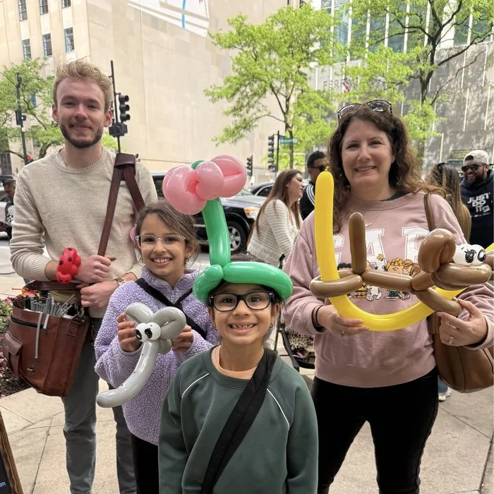 Michael Romani with a mom and her two kids on Michigan Avenue