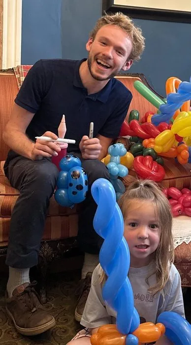 Michael Romani laughing with a young girl at a Chicago daycare